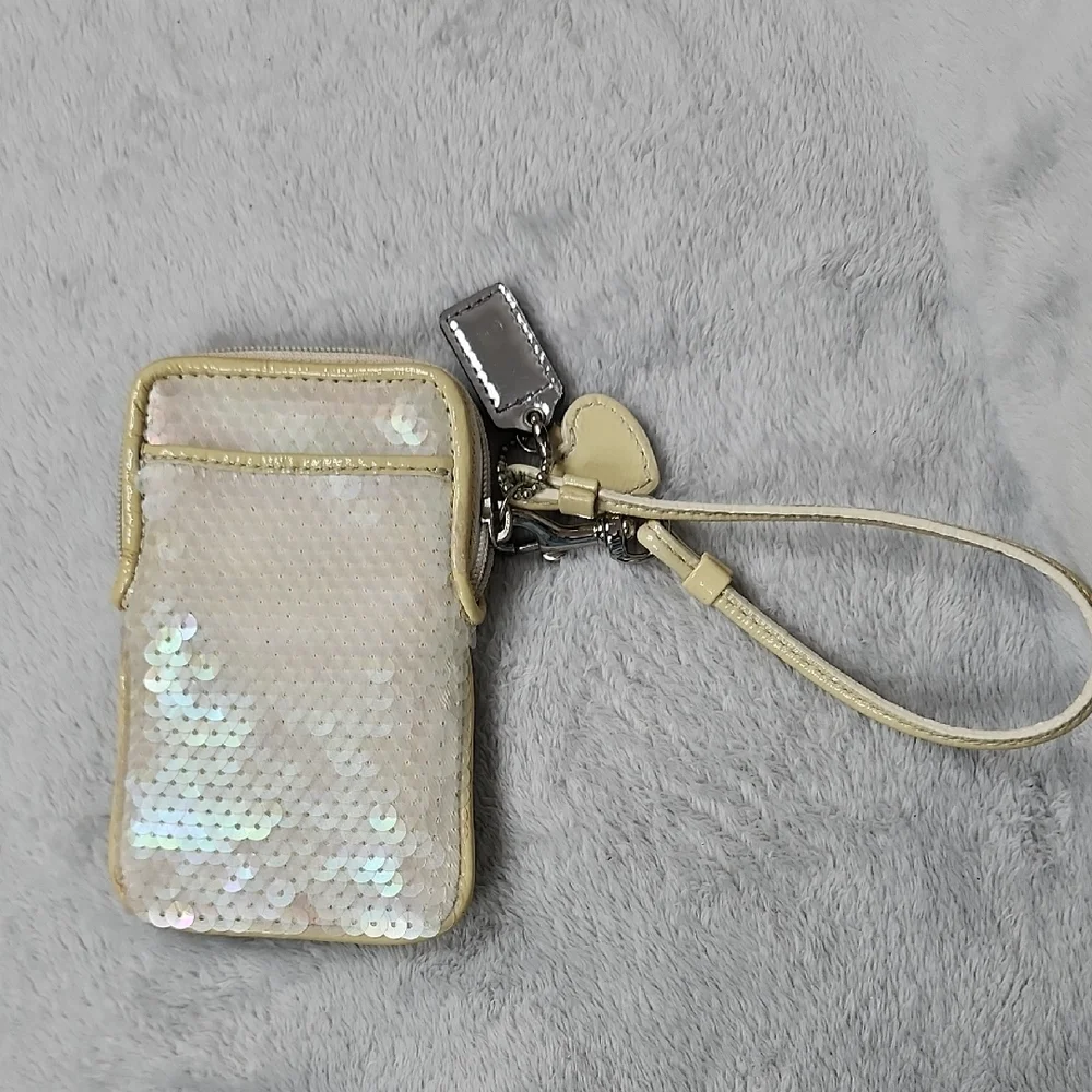 Coach Poppy vintage cream iridescent sequin small wristlet.